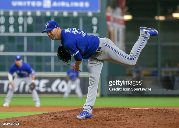 Toronto Blue Jays starting pitcher J.A. Happ watches his pitch during the baseball game between the Toronto Blue Jays and Houston Astros on June 25,...