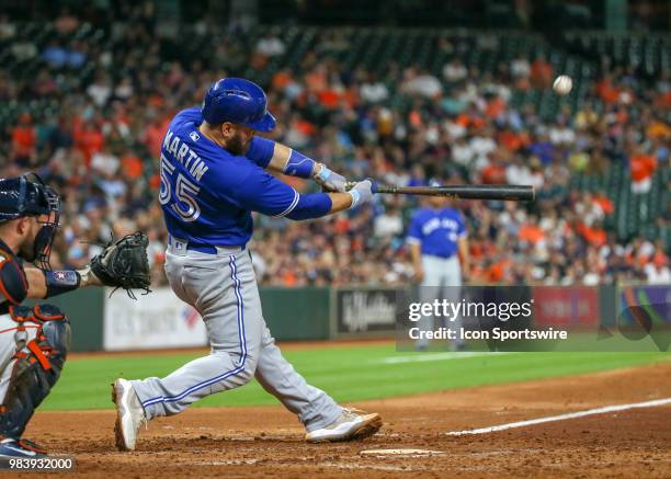 Toronto Blue Jays catcher Russell Martin hits a foul ball in the top of the fourth inning during the baseball game between the Toronto Blue Jays and...