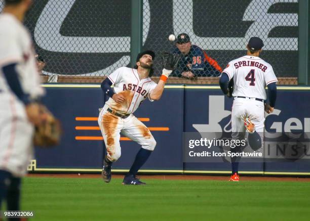 Houston Astros center fielder Jake Marisnick catches a pop fly hit by Toronto Blue Jays catcher Russell Martin in the top of the sixth inning during...