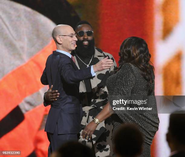 Adam Silver, MVP winner James Harden, and Monja Willis embrace onstage at the 2018 NBA Awards at Barkar Hangar on June 25, 2018 in Santa Monica,...