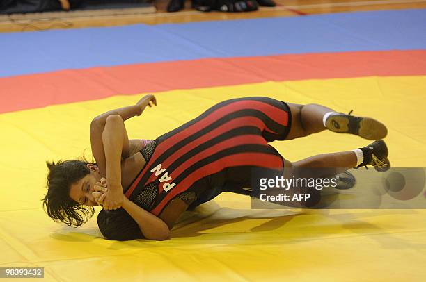 Nicaraguan Dayana Alguera and Panamanian Francia Rodriguez wrestle in the 72 kg greco roman wrestling category in the IX Central American Games in...