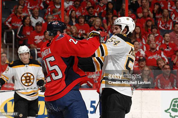 Adam McQuaid of the Boston Bruins mixes it up with Jason Chimera of the Washington Capitals during an NHL hockey game on April 11, 2010 at the...
