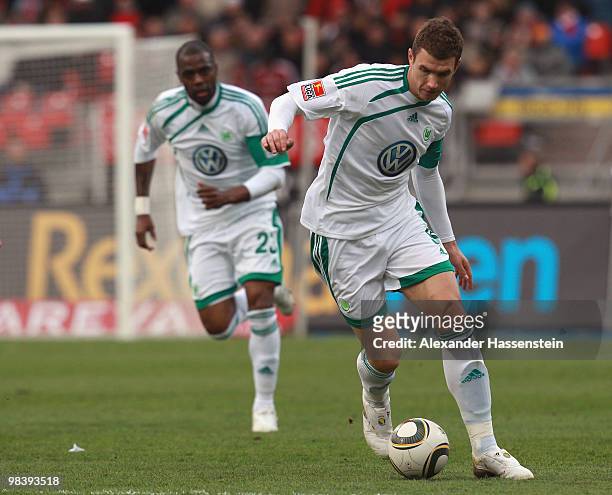 Edin Dzeko of Wolfsburg runs with the ball during the Bundesliga match between 1. FC Nuernberg and VfL Wolfsburg at Easycredit Stadium on April 11,...