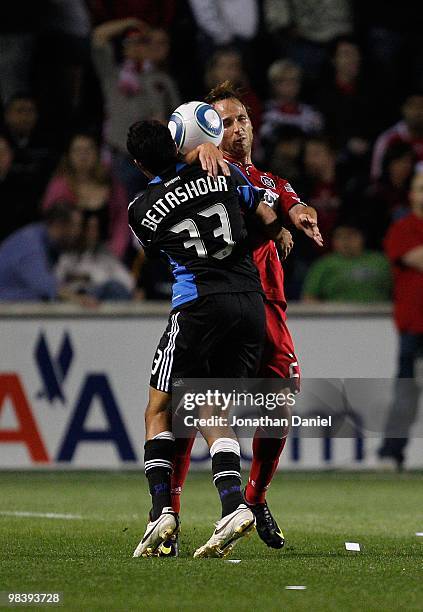 Justin Mapp of the Chicago Fire collides with Steve Beitashour of the San Jose Earthquakes in an MLS match on April 10, 2010 at Toyota Park in...