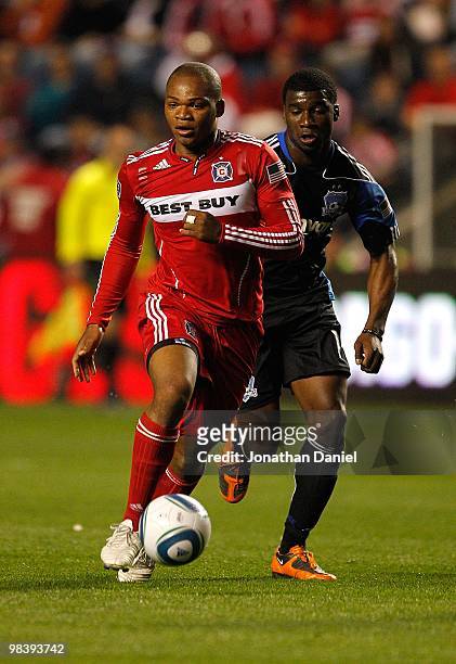 Collins John of the Chicago Fire moves past Ramon Sanchez of the San Jose Earthquakes in an MLS match on April 10, 2010 at Toyota Park in Brideview,...