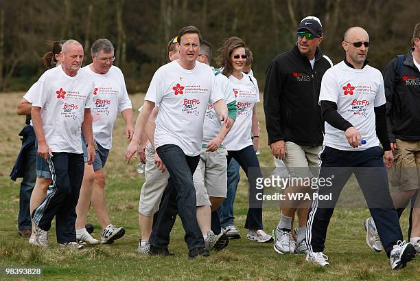 Conservative leader David Cameron, Britain's opposition party, centre left, and former cricketer Ian Botham, centre right, take part in the 'Forget...