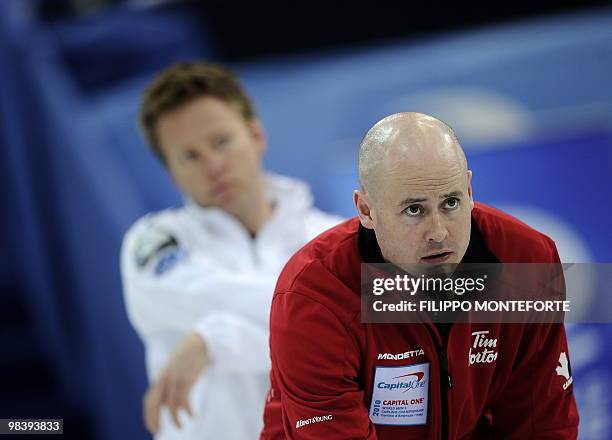 Canada's skipper Kevin Koe looks on in front of Norway's skipper Torger Nergard during the Men's world curling championship final in Cortina...