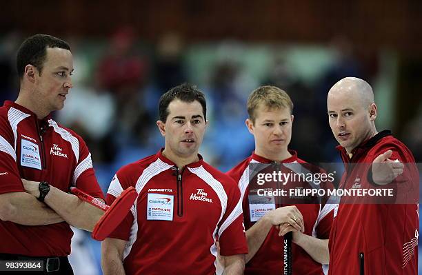 Canada's skipper Kevin Koe talks to teamates during the Men's world curling championship final in Cortina D'Ampezzo on April 11, 2010. Canada won...