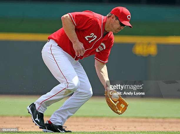 Scott Rolen of the Cincinnati Reds fields a ground ball during the game against the Chicago Cubs on April 11, 2010 at Great American Ball Park in...