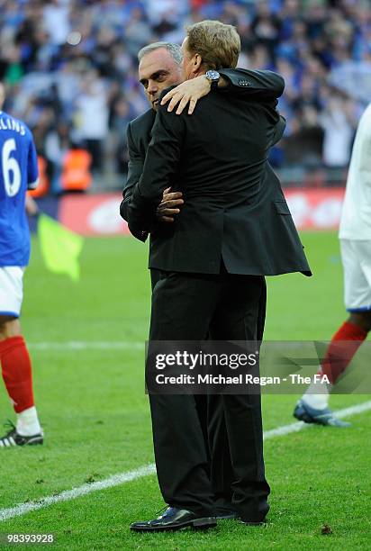 Portsmouth manager Avram Grant embraces Tottenham Hotspur manager Harry Redknapp after Portsmouth won the game during the FA Cup sponsored by E.ON...