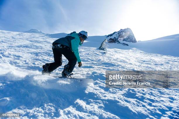 woman snowboarding - francis winter stock-fotos und bilder