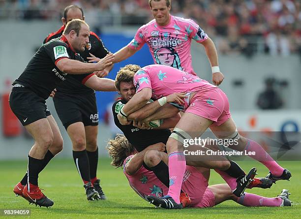 Vincent Clerc of Toulousain is tackled by Dimitri Szarzewski and Pascal Pape of Francais during the Heineken Cup Quarter Final match between Stade...