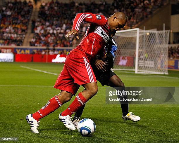 Collins John of the Chicago Fire tries to move around Ike Opara of the San Jose Earthquakes in an MLS match on April 10, 2010 at Toyota Park in...