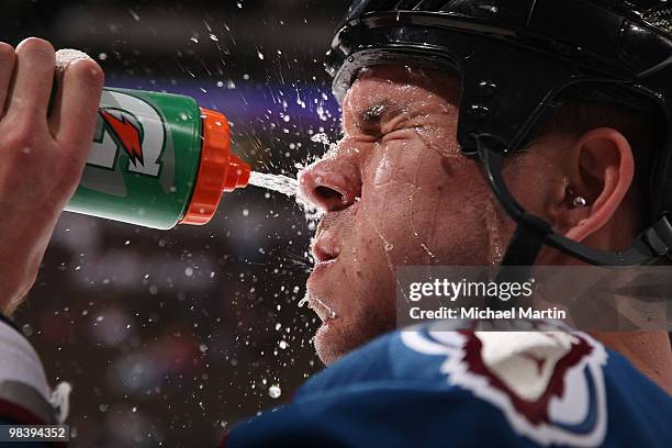 Scott Hannan of the Colorado Avalanche cools off with a splash of water before the start of a game against the Los Angeles Kings at the Pepsi Center...