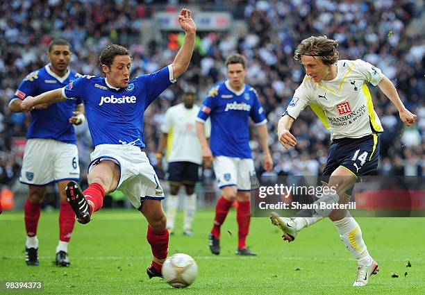 Michael Brown of Portsmouth attempts to block the shot by Luka Modric of Tottenham Hotspur during the FA Cup sponsored by E.ON Semi Final match...