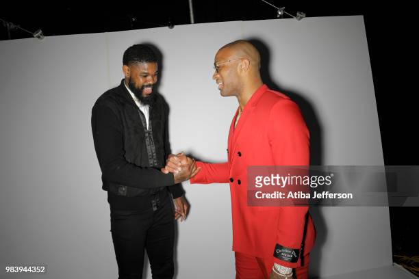 Amir Johnson of the Philadelphia 76ers and PJ Tucker of the Houston Rockets shake hands at the NBA Awards Show on June 25, 2018 at the Barker Hangar...