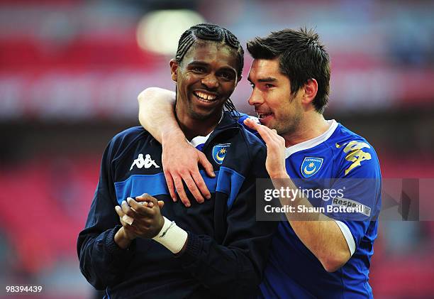 Nwankwo Kanu and Richard Hughes of Portsmouth celebrate victory in the FA Cup sponsored by E.ON Semi Final match between Tottenham Hotspur and...