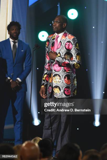 Reggie Miller, Yvonne Orji and Joel Embiid of the Philadelphia 76ers present Dikembe Mutombo with the Craig Sager Strong Award during the 2018 NBA...