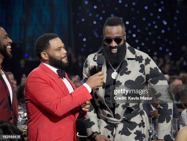 Host Anthony Anderson and James Harden speak in the audience during the 2018 NBA Awards at Barkar Hangar on June 25, 2018 in Santa Monica, California.