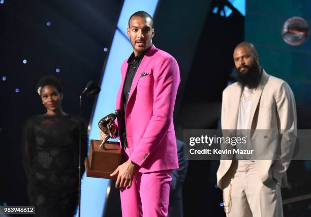 Defensive Player of the Year Rudy Gobert speaks onstage at the 2018 NBA Awards at Barkar Hangar on June 25, 2018 in Santa Monica, California.