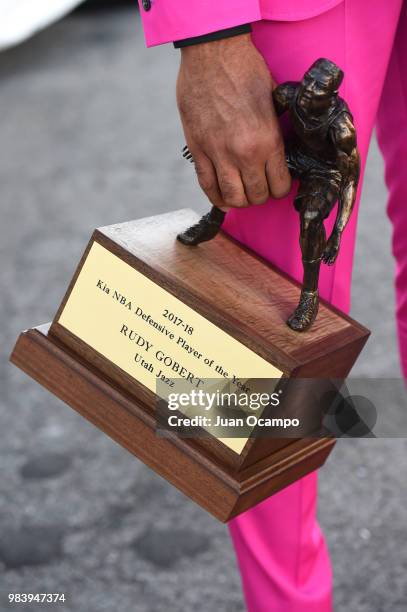 Rudy Gobert of the Utah Jazz holds his award for NBA Defensive Player of the Year during the 2018 NBA Awards Show on June 25, 2018 at The Barkar...