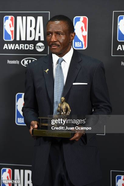 Head Coach Dwayne Casey of the Detroit Pistons poses for a photograph with his award during the 2018 NBA Awards Show on June 25, 2018 at The Barkar...