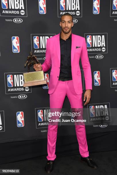 Rudy Gobert of the Utah Jazz poses for a photograph with his award during the 2018 NBA Awards Show on June 25, 2018 at The Barkar Hangar in Santa...