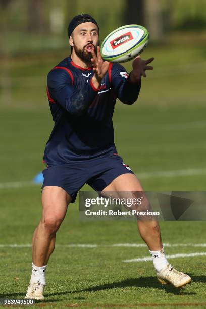 Michael Ruru takes the ball during a Melbourne Rebels Super Rugby training session at AAMI Park on June 26, 2018 in Melbourne, Australia.