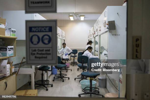 Technicians test drugs in bio-safety cabinets at a GangaGen Inc. Laboratory in Bengaluru, India, on Wednesday, May 30, 2018. The rapid spread of...