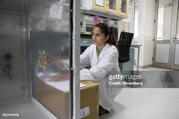 Technician attaches a nebulizer to a box filled with bacteria during testing inside a Biomoneta laboratory in Bengaluru, India, on Friday, June 1,...