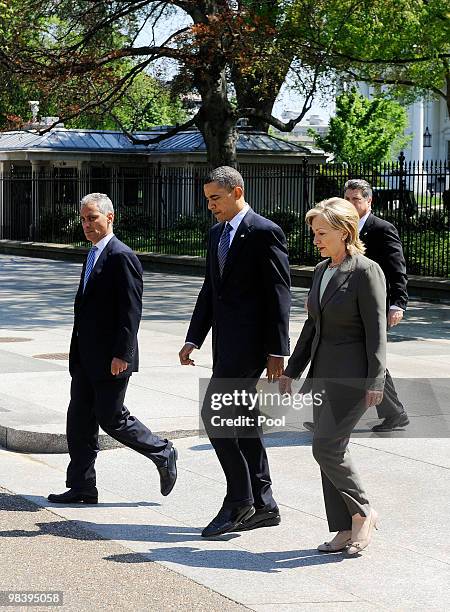 President Barack Obama , flanked by White House Chief of Staff Rahm Emanuel and Secretary of State Hillary Clinton , walks from the White House to...