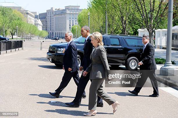 President Barack Obama , flanked by White House Chief of Staff Rahm Emanuel and Secretary of State Hillary Clinton , walks from the White House to...