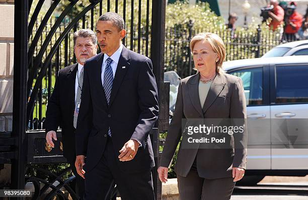 President Barack Obama and Secretary of State Hillary Clinton walk from the White House to the Blair House to participate in bilateral meetings April...