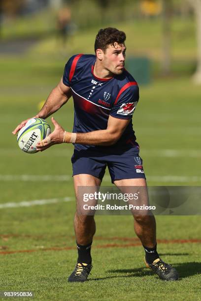 Tom English looks to offload during a Melbourne Rebels Super Rugby training session at AAMI Park on June 26, 2018 in Melbourne, Australia.