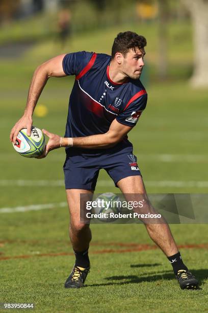 Tom English looks to offload during a Melbourne Rebels Super Rugby training session at AAMI Park on June 26, 2018 in Melbourne, Australia.