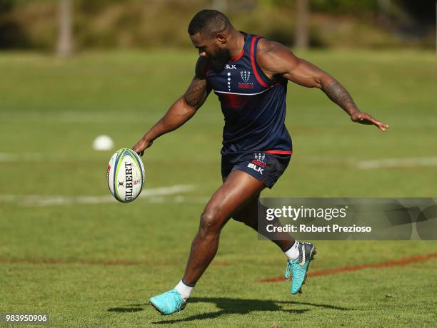 Marika Koroibete kicks during a Melbourne Rebels Super Rugby training session at AAMI Park on June 26, 2018 in Melbourne, Australia.