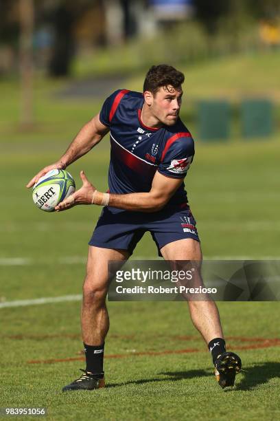 Tom English looks to offload during a Melbourne Rebels Super Rugby training session at AAMI Park on June 26, 2018 in Melbourne, Australia.