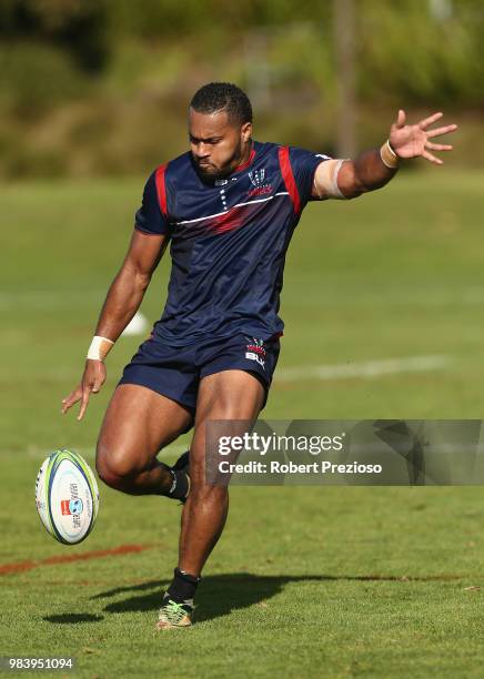 Sefanaia Naivalu kcks during a Melbourne Rebels Super Rugby training session at AAMI Park on June 26, 2018 in Melbourne, Australia.