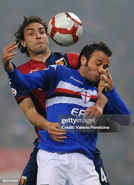 Giampaolo Pazzini of UC Sampdoria is challenged by Emiliano Moretti of Genoa CFC during the Serie A match between UC Sampdoria and Genoa CFC at...