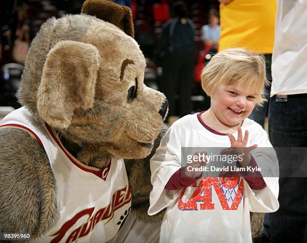 Cleveland Cavaliers mascot Moondog gives a young fan his jersey on Fan Appreciation Day after the game against the Orlando Magic on April 11, 2010 at...