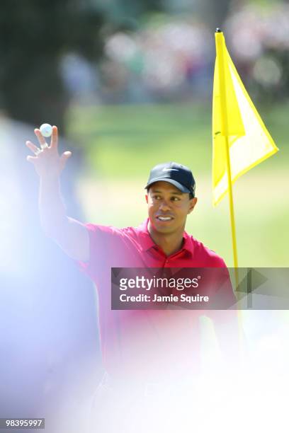 Tiger Woods reacts to holing out for eagle on the seventh hole during the final round of the 2010 Masters Tournament at Augusta National Golf Club on...
