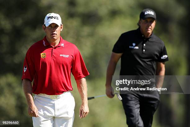 Lee Westwood of England and Phil Mickelson walk to the seventh green during the final round of the 2010 Masters Tournament at Augusta National Golf...