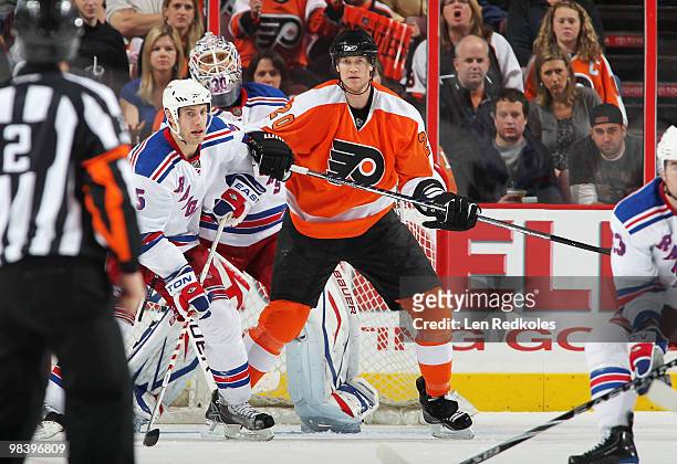 Chris Pronger of the Philadelphia Flyers sets up in the crease for a short-handed shot on goal against Henrik Lundqvist and Dan Girardi of the New...