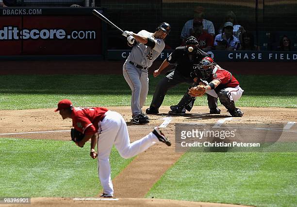 Garrett Jones of the Pittsburgh Pirates hits an RBI on a fielders choice against the Arizona Diamondbacks during the first inning of the major league...