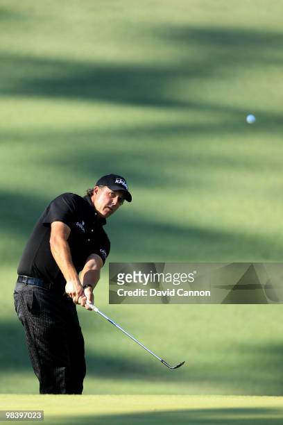Phil Mickelson hits a pitch shot on the tenth hole during the final round of the 2010 Masters Tournament at Augusta National Golf Club on April 11,...