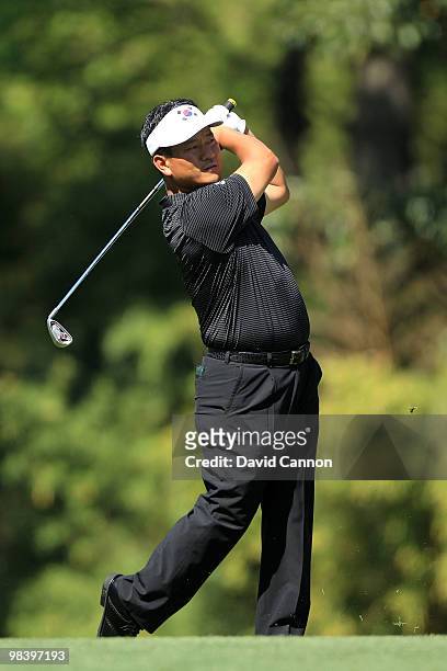 Choi of South Korea watches his tee shot on the 12th hole during the final round of the 2010 Masters Tournament at Augusta National Golf Club on...