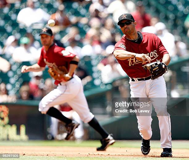 Third baseman Pedro Feliz of the Houston Astros throws to first at Minute Maid Park on April 11, 2010 in Houston, Texas.