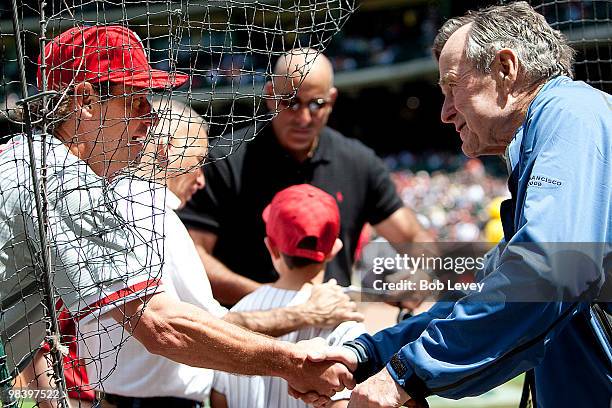 Pitcher Jamie Moyer of the Philadelphia Phillies shakes hands with former President George H.W. Bush before the game on April 11, 2010 in Houston,...