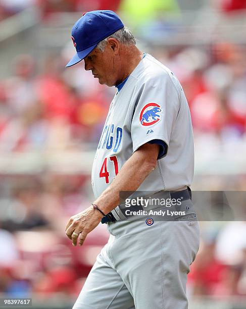 Lou Piniella of the Chicago Cubs walks to the mound during the game against the Cincinnati Reds on April 11, 2010 at Great American Ball Park in...