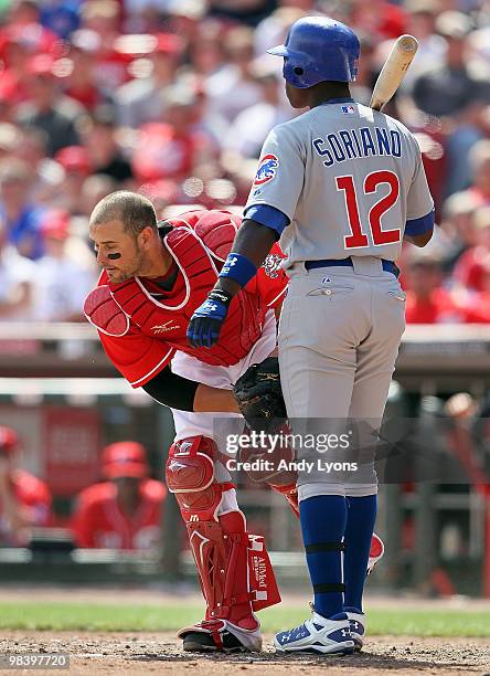 Alfonso Soriano of the Chicago Cubs is tagged out by Ramon Hernandez of the Cincinnati Reds after swinging at a third strike during the game on April...